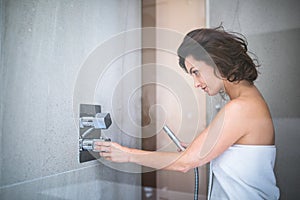 Woman taking a long hot shower washing her hair