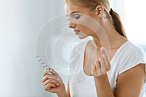 Woman Taking Medicine. Beautiful Girl With Pill Pack With Pills