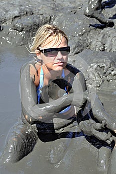 Woman taking a mud bath