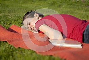 Woman taking a nap in a garden