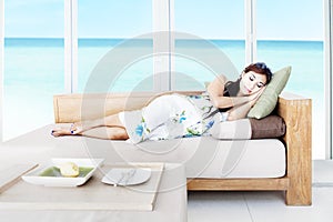 Woman taking a nap in living room