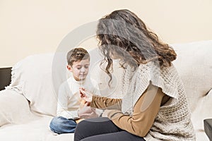 Woman taking a nasal swab from a child