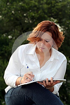 Woman taking notes