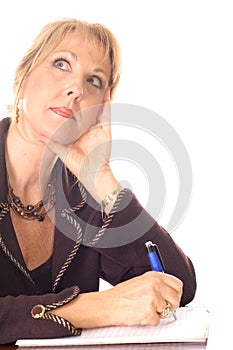 Woman taking notes thinking photo