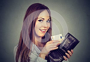 Woman taking out money euro banknotes from wallet