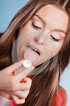 Woman taking painkiller pill tablet. Health care.