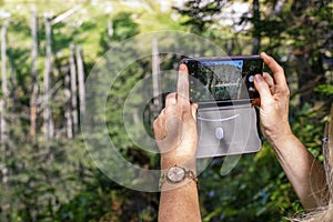 Woman taking a photo with cell phone