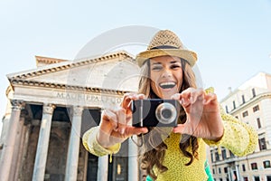 Woman taking photo in front of pantheon in rome
