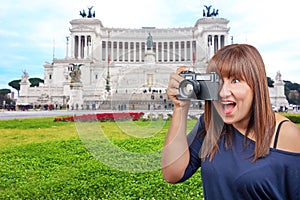 Woman taking photo Monument Victor Emanuel II Rome Italy photo