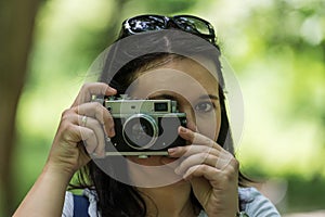 Woman taking photo at park outdoor