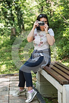 Woman taking photo at park outdoor