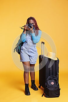 Woman taking photographs on dslr camera