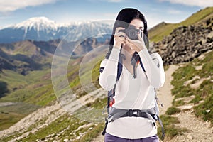 Woman taking picture with a digital camera