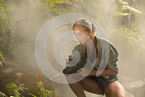 Woman is taking picture in the jungle