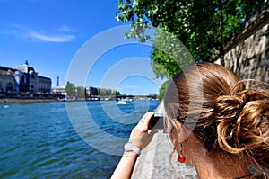 Woman taking picture in Paris