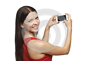 Woman taking pictures through cell phone