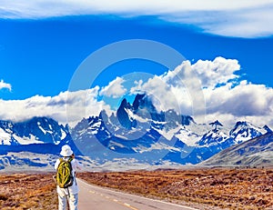 Woman taking pictures of Mount Fitz Roy