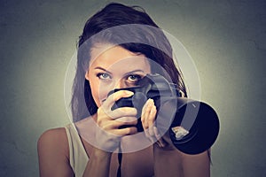 Woman taking pictures with professional dslr camera