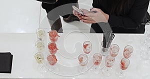Woman taking pictures on smartphone cocktails