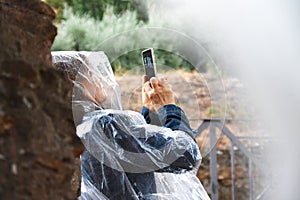 Woman taking pictures using cell phone