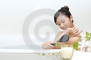 Woman taking relaxing bath