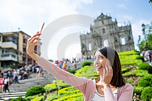 Woman taking self image in Macau city