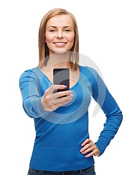 Woman taking self picture with smartphone camera