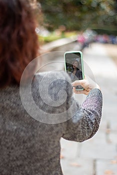 Woman taking a selfie with her mobile phone. photo