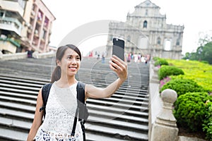 Woman taking selfie by mobile phone