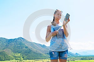 Woman taking selfie on mobile phone