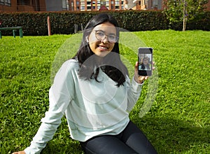 Woman taking a selfie photo with phone