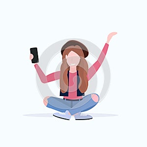 Woman taking selfie photo on smartphone camera casual female cartoon character sitting girl in hat posing on white