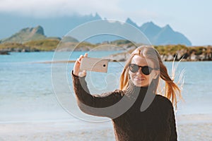 Woman taking selfie photo by smartphone travel blogging influencer lifestyle