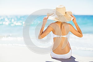 Woman taking sunbath on beach