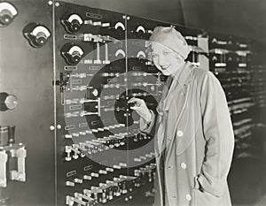 Woman taking a tour of 1930s recording studio