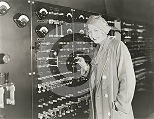 Woman taking a tour of 1930s recording studio photo