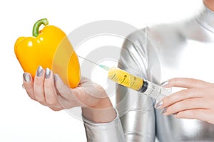 woman taking vitamins from sweet pepper photo