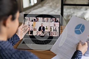 Woman talk discuss paperwork on video call with colleagues