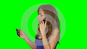 Woman talk on phone in hand hold picture of pregnancy. Chroma key screen. 4K