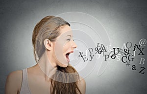 Woman talking with alphabet letters coming out of mouth