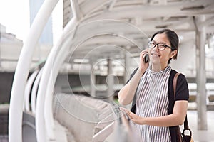 Woman talking business with her mobile phone.