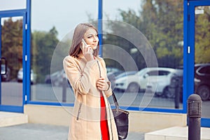 Woman talking on mobile outdoors