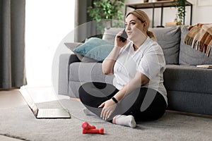 Woman talking on mobile during workout