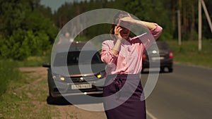 Woman Talking On The Phone With Evacuator Service