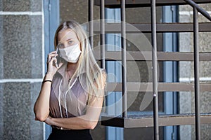 Woman talking phone mobile wear mask during disease pandemic and to prevent dust that may enter the body through the nose and