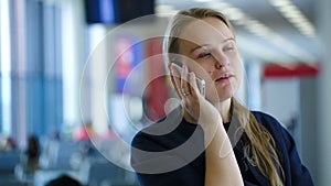 Woman talking on the phone in the waiting room