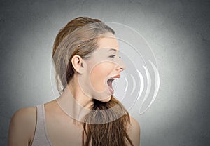 Woman talking with sound waves coming out of mouth