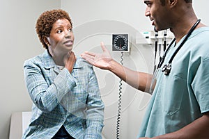 Woman talking to doctor photo