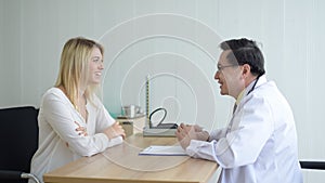 Woman talking to doctor psychiatrist in hospital