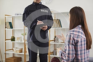 Woman talking to policeman after breaking into house